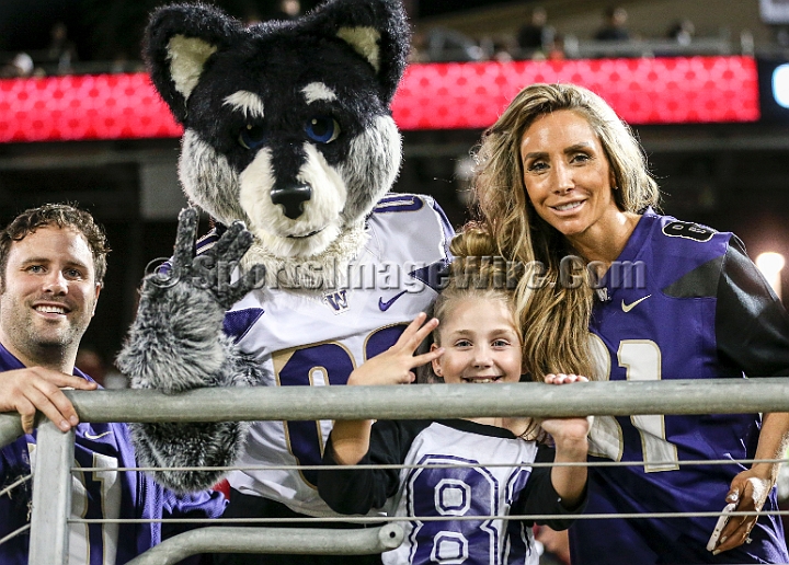 2015StanWash-016.JPG - Oct 24, 2015; Stanford, CA, USA; Washington Huskies mascot Hairy poses with fans prior to game against the  Stanford Cardinal at Stanford Stadium. 